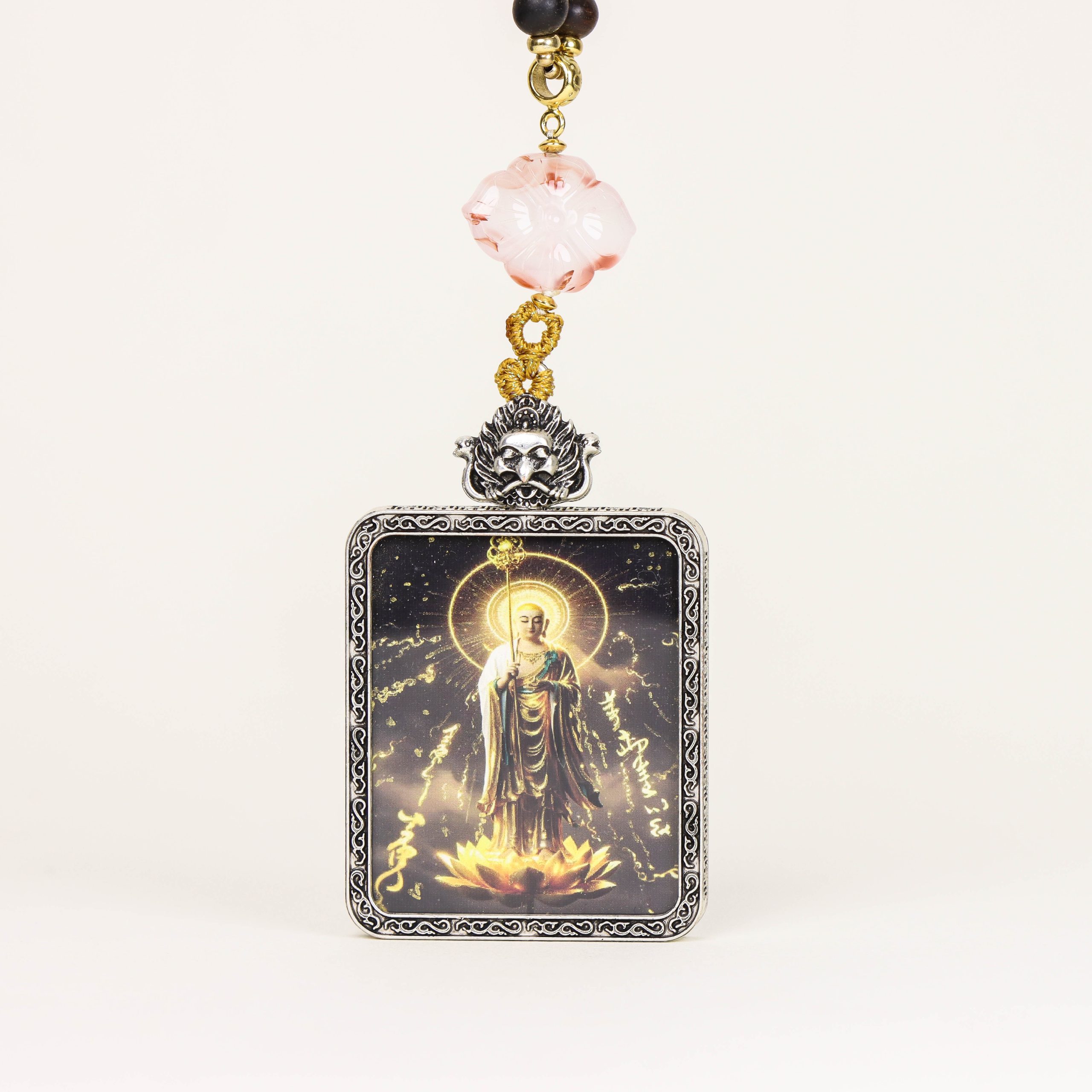 Black and gold Buddha amulets and Thangkas